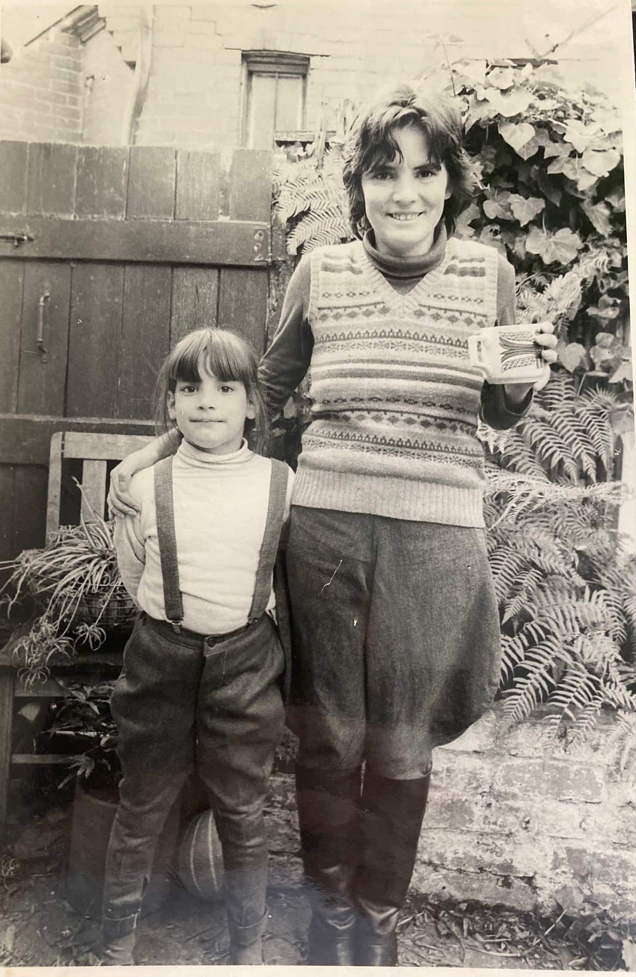 A black and white photo of a woman with her daughter