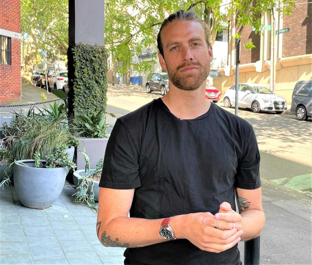 RecycleSmart co-founder Marco Prayer standing in the street 