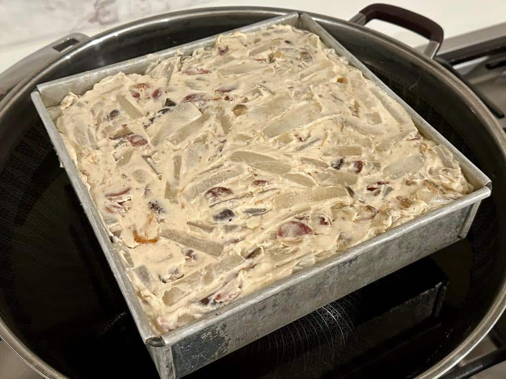 Put the turnip cake ingredient mixture in a container