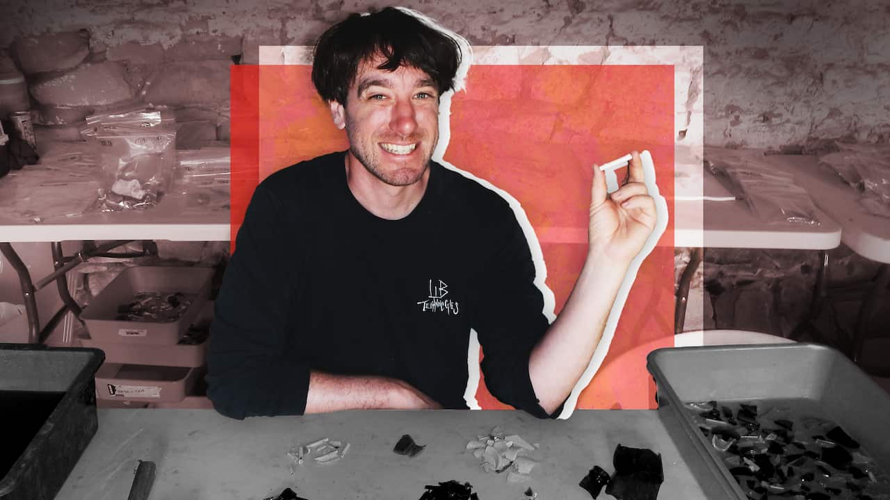 A man holding an artefact.