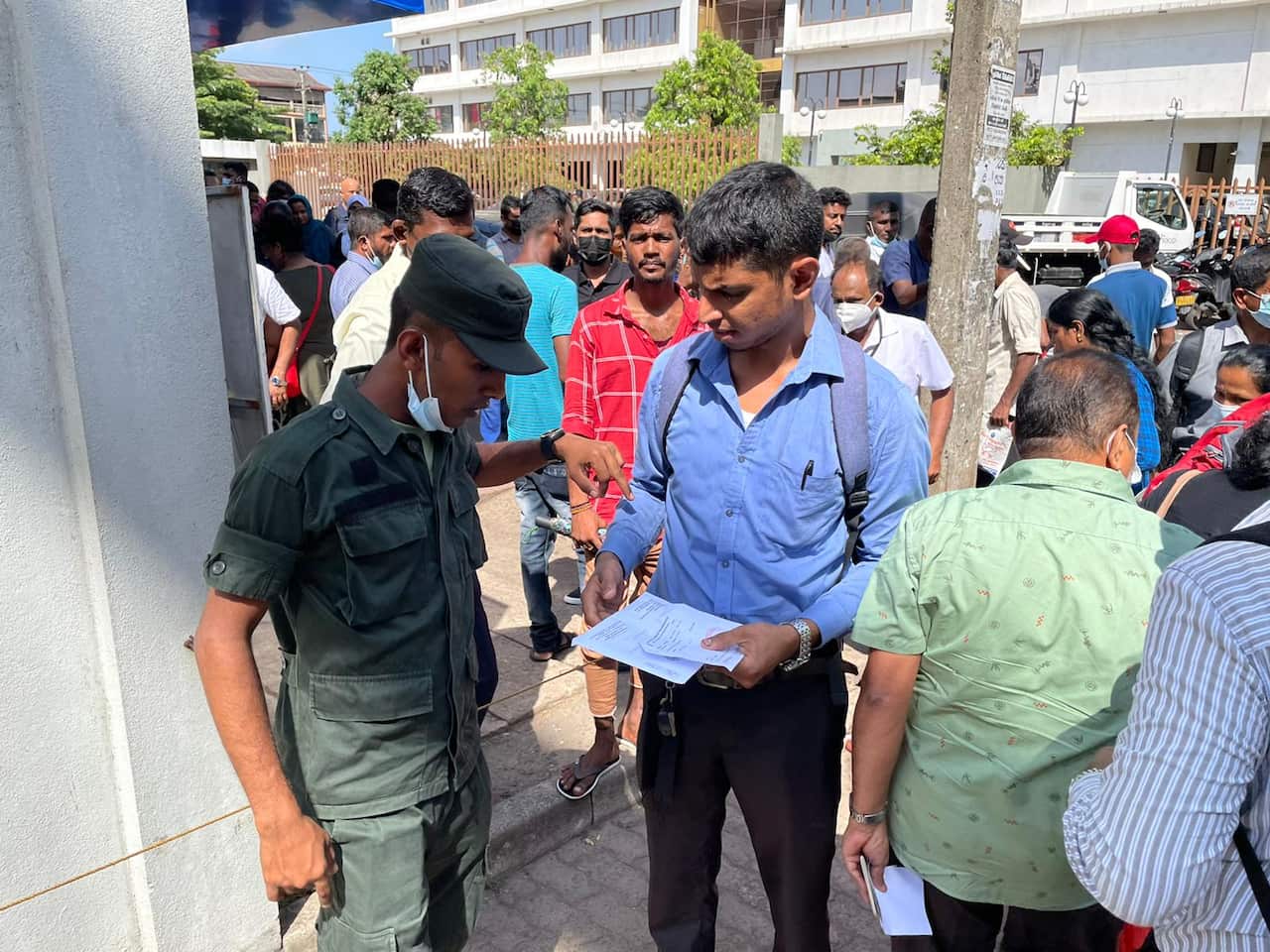 People standing in a queue in Sri Lanka