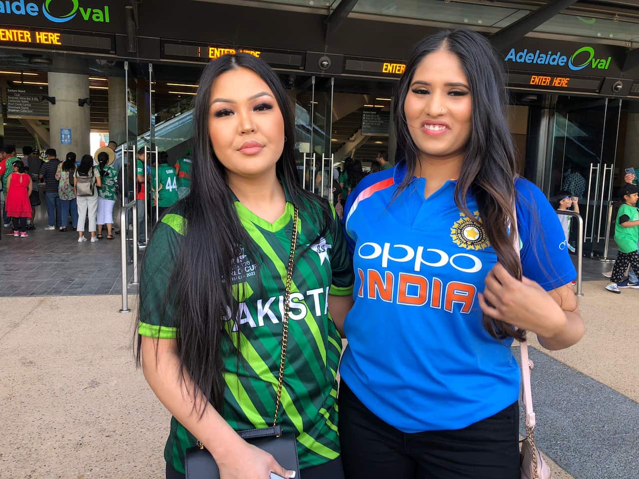 Indian and Pakistani fans celebrating Pakistan's win together in Adelaide. 