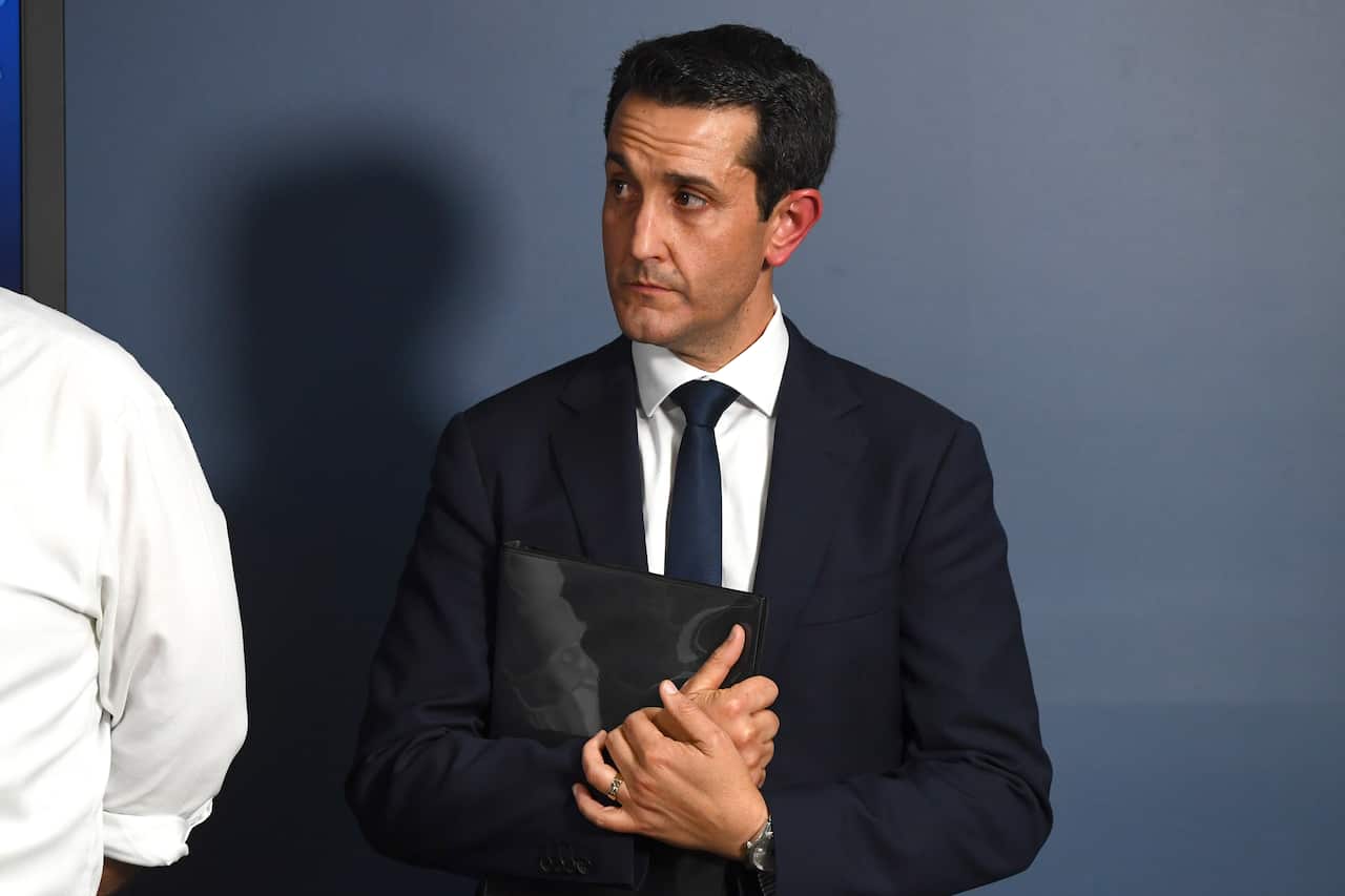 A man in a suit at a press conference 