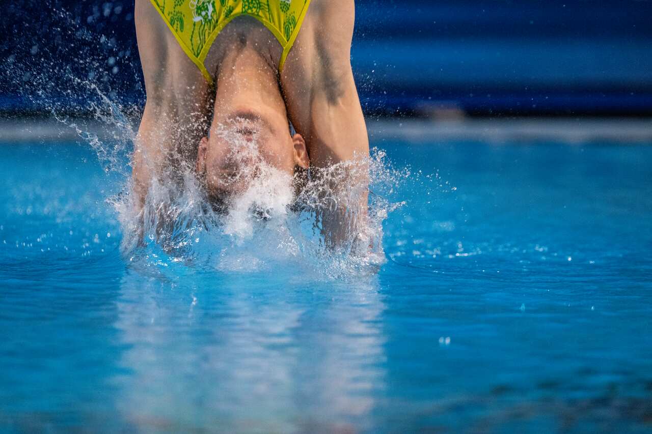 Maddison Keeney diving into the water. 