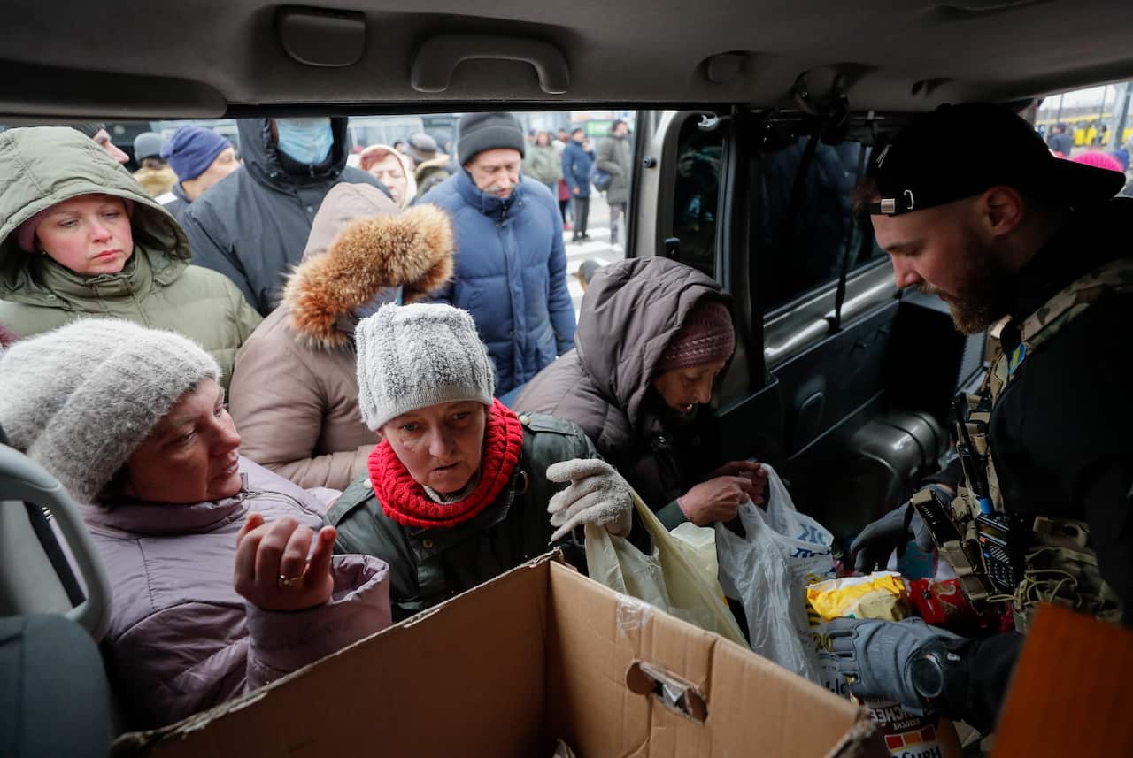 Locals receive humanitarian aid in Bucha city near Kyiv, Ukraine, 5 April 2022. 