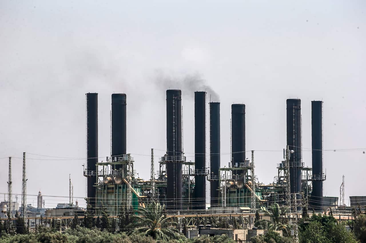 Smoke rises out of power plant