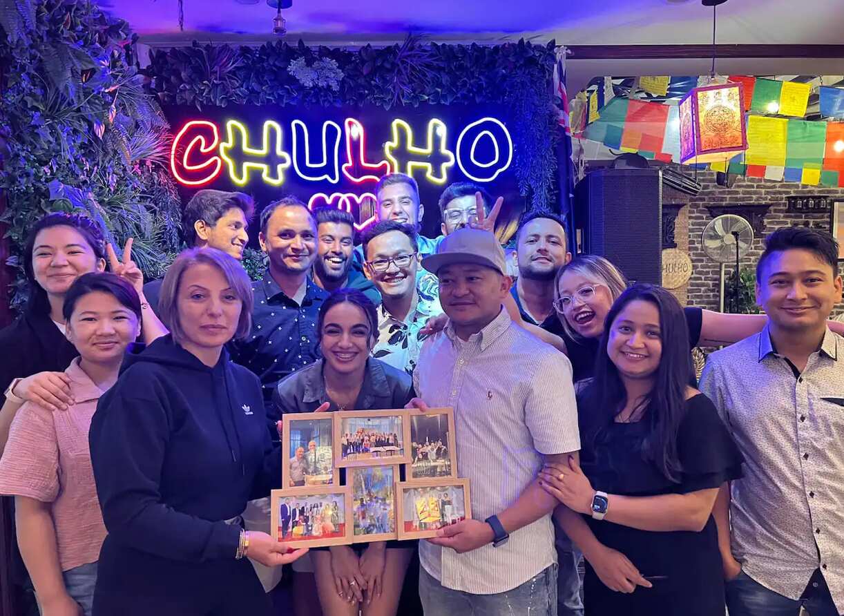 Sujan Shrestha (in the middle with a white shirt), Prajjwal Shrestha (right), and their colleagues from On Sunset restaurant.