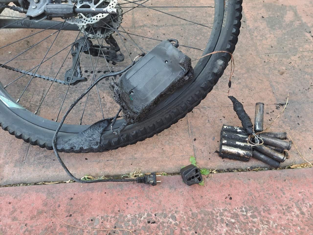 Migrants watch a large fire as it burns inside the Moria refugee camp on the northeastern Greek island of Lesbos, late Monday, Sept. 19. 2016. 