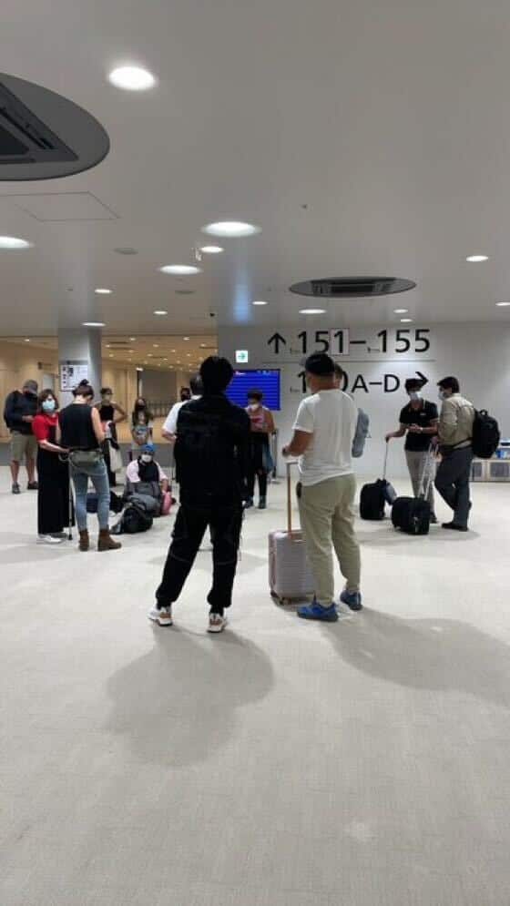 Travellers waiting at an airport.
