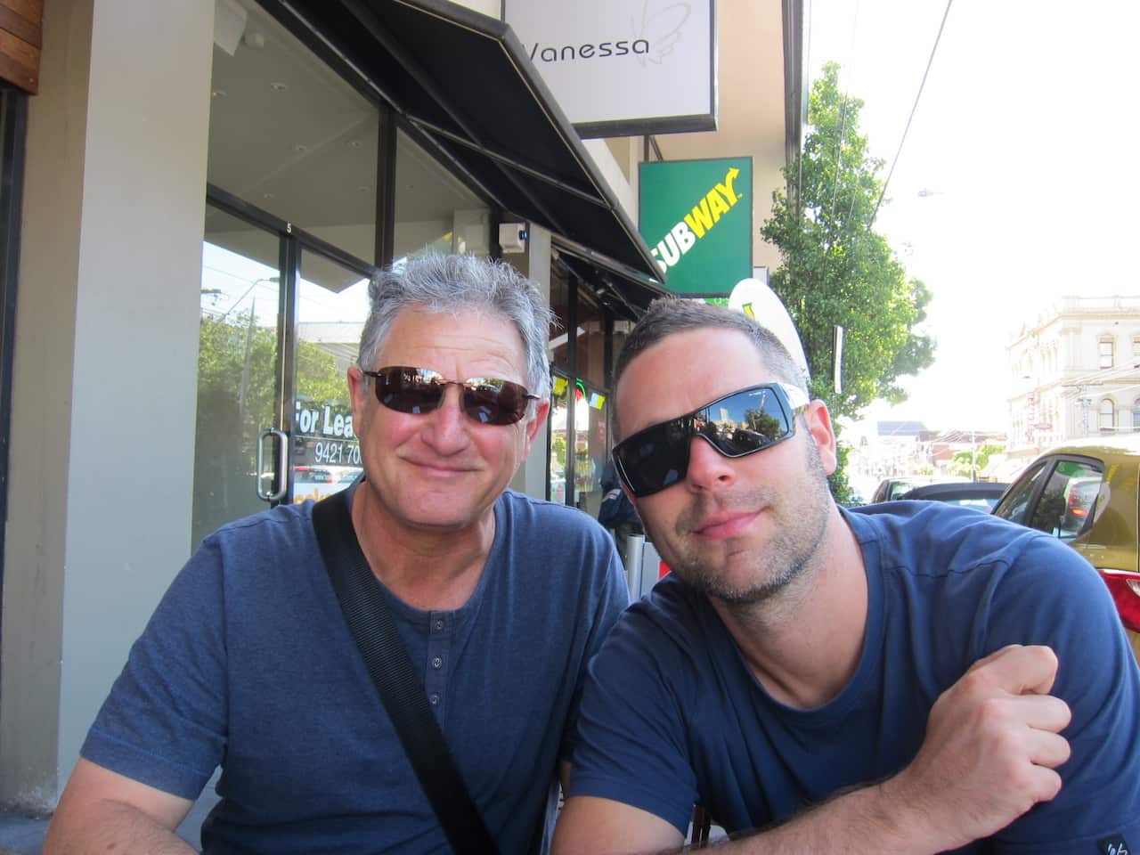 Glenn sitting next to his son Tim