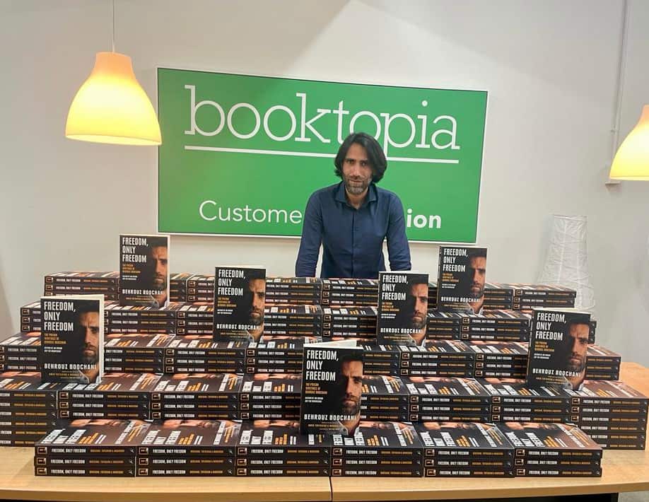 Behrouz Boochani signing his new book, 'Freedom, Only Freedom'