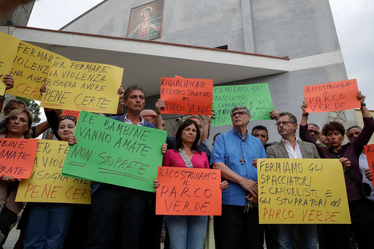 Caivano, the solidarity march for young cousins victims of abuse and violence by young boys in the green park, where Father Patriciello, parish priest of the neighborhood, parades together with politicians