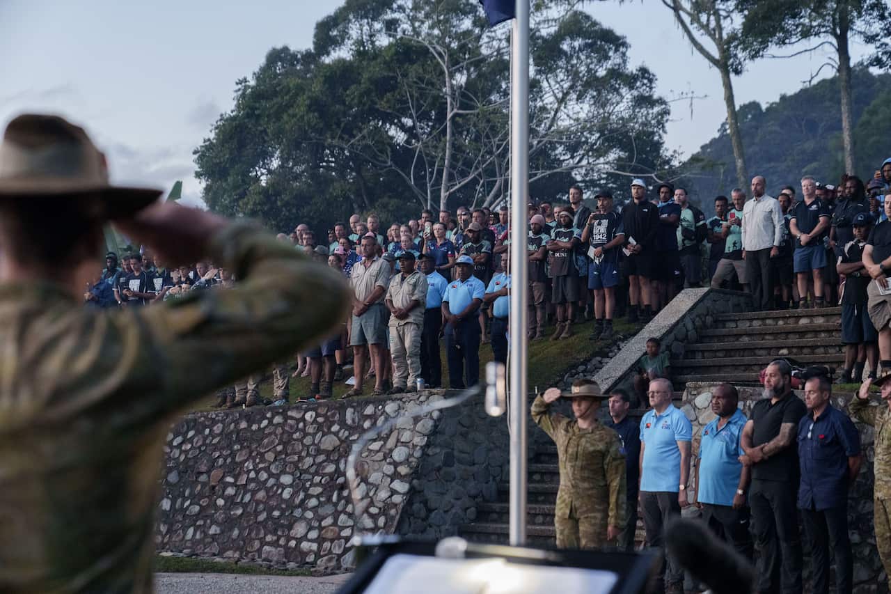 People at an Anzac Day dawn service.