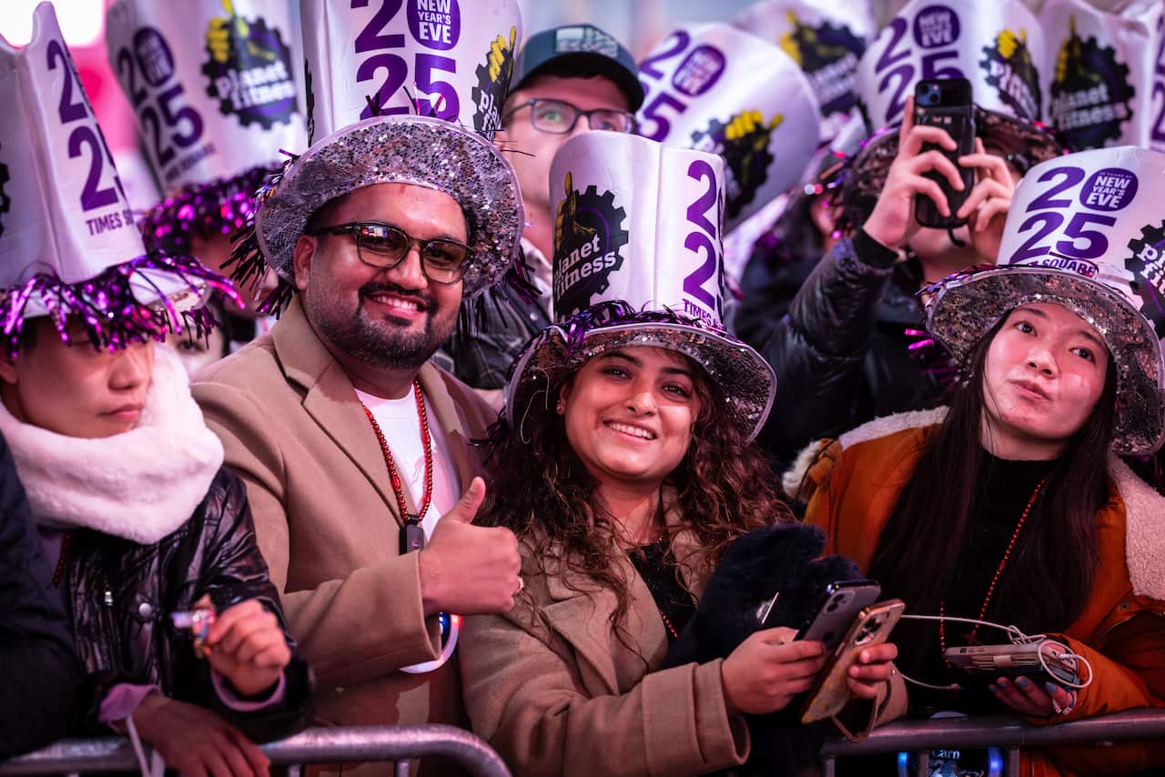 People wearing 2025 hats.