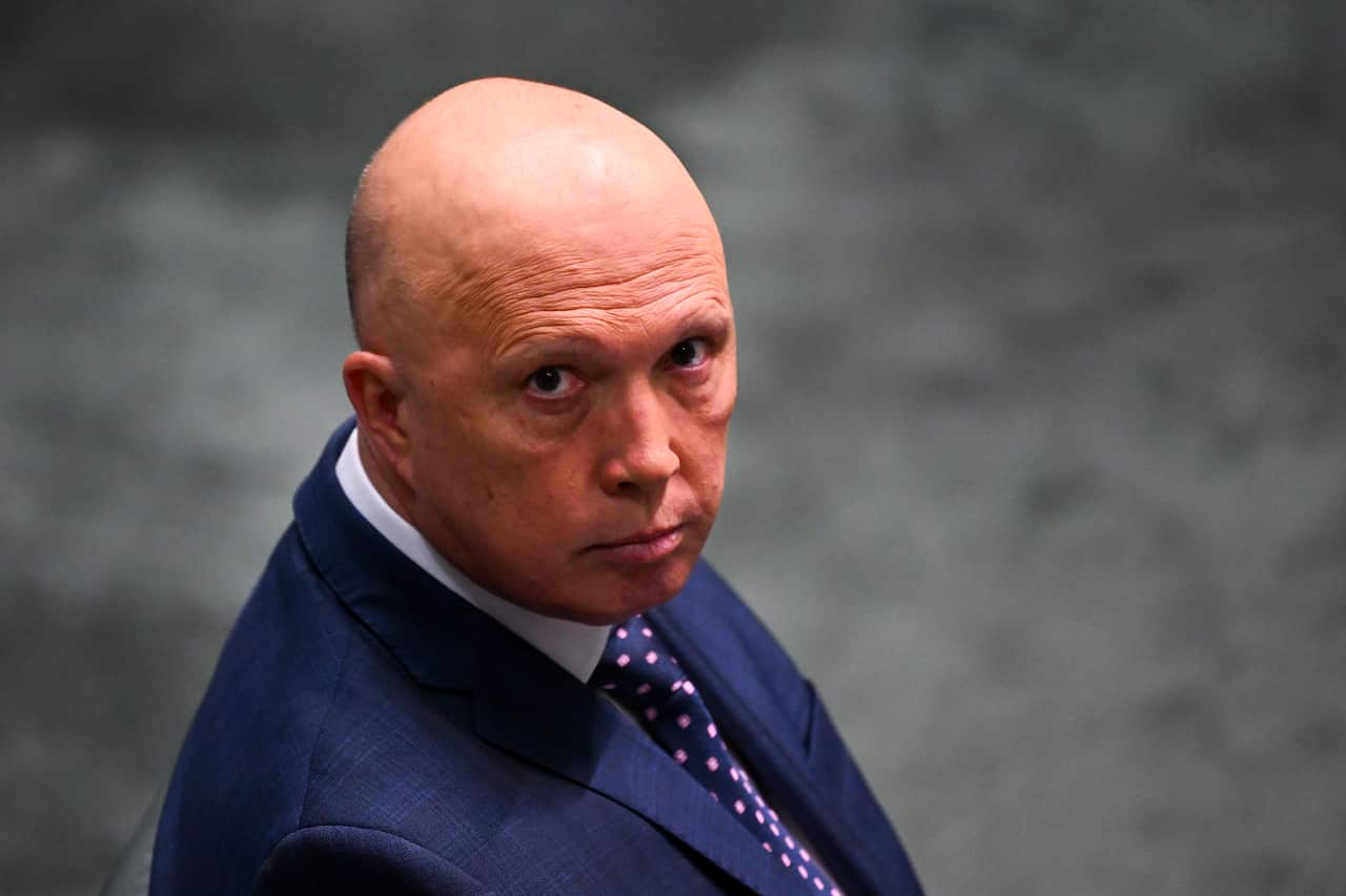 Peter Dutton wearing a suit and tie in Parliament House