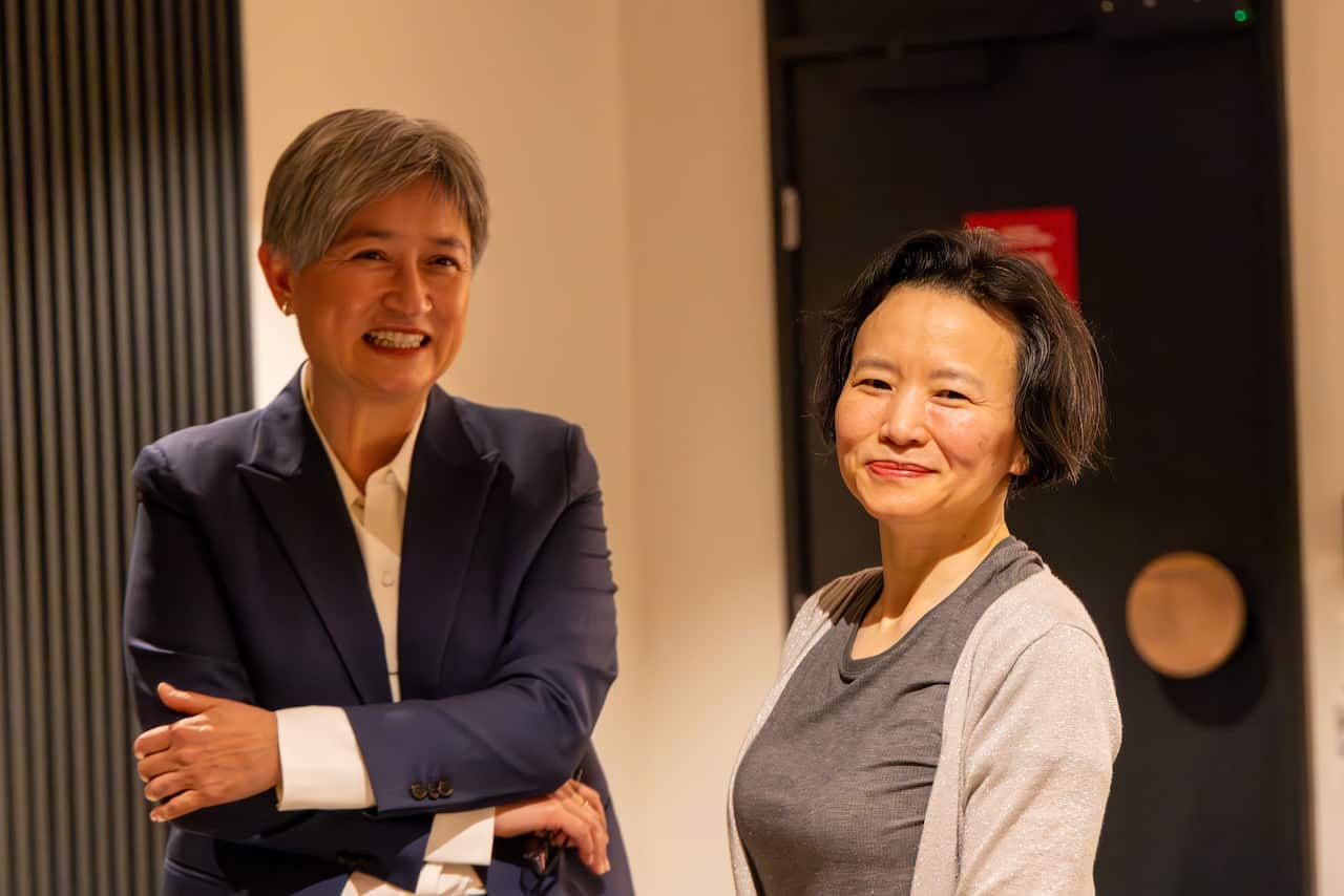 Cheng Lei and Penny Wong smiling.