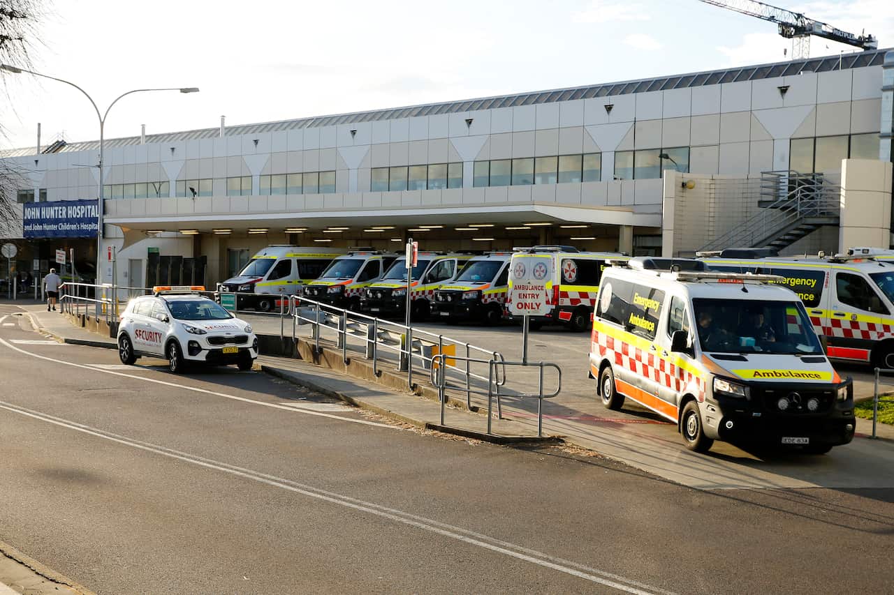 Ambulances parked at a hospital.