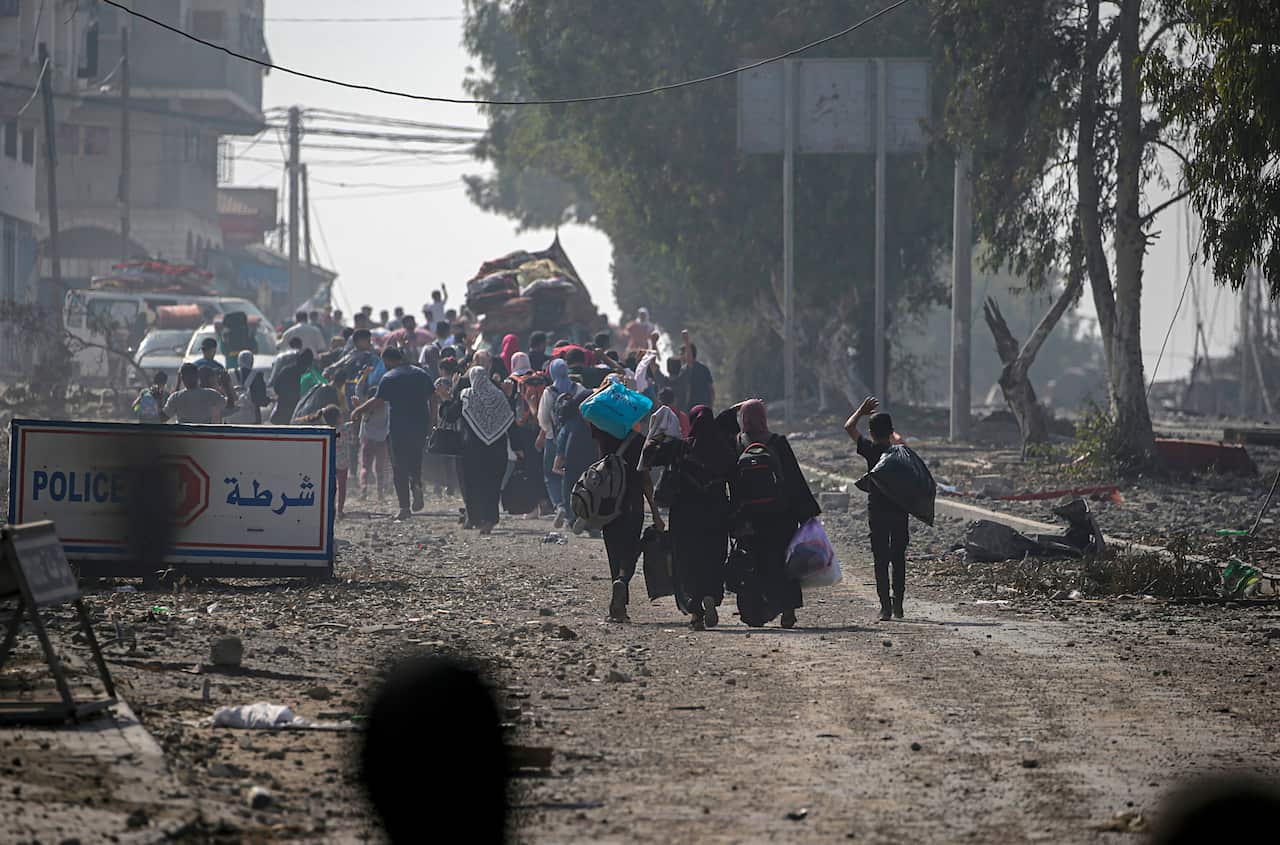 Residents evacuate the northern Gaza Strip by foot.