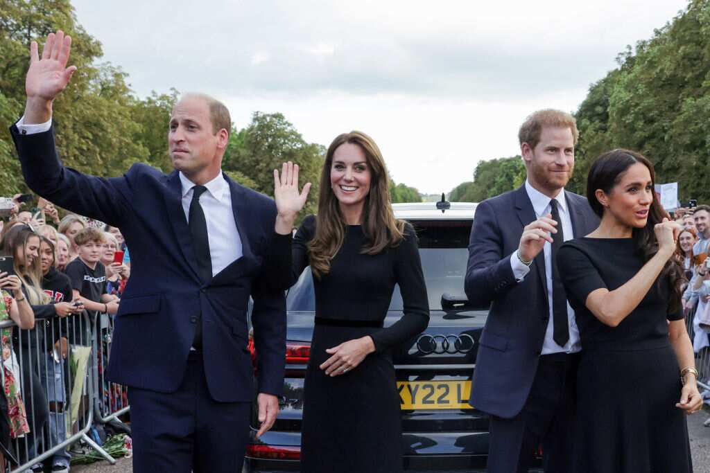 Britain's Prince William, Prince of Wales, Britain's Catherine, Princess of Wales, Britain's Prince Harry, Duke of Sussex, Britain's Meghan, Duchess of Sussex, wave at well-wishers on the Long walk at Windsor Castle.