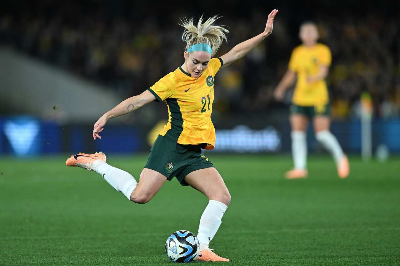 Ellie Carpenter kicks the ball during the friendly match between Australia and France on 14 July 2023.