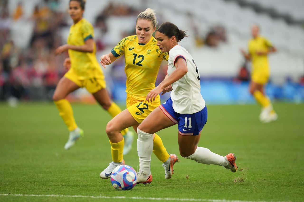Sophia Smith of the United States is defended by Ellie Carpenter during the second half of the Women's group B match during the Olympic Games Paris 2024 at Stade Velodrome.
