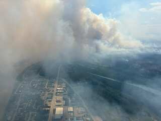 Smoke billows above a township.
