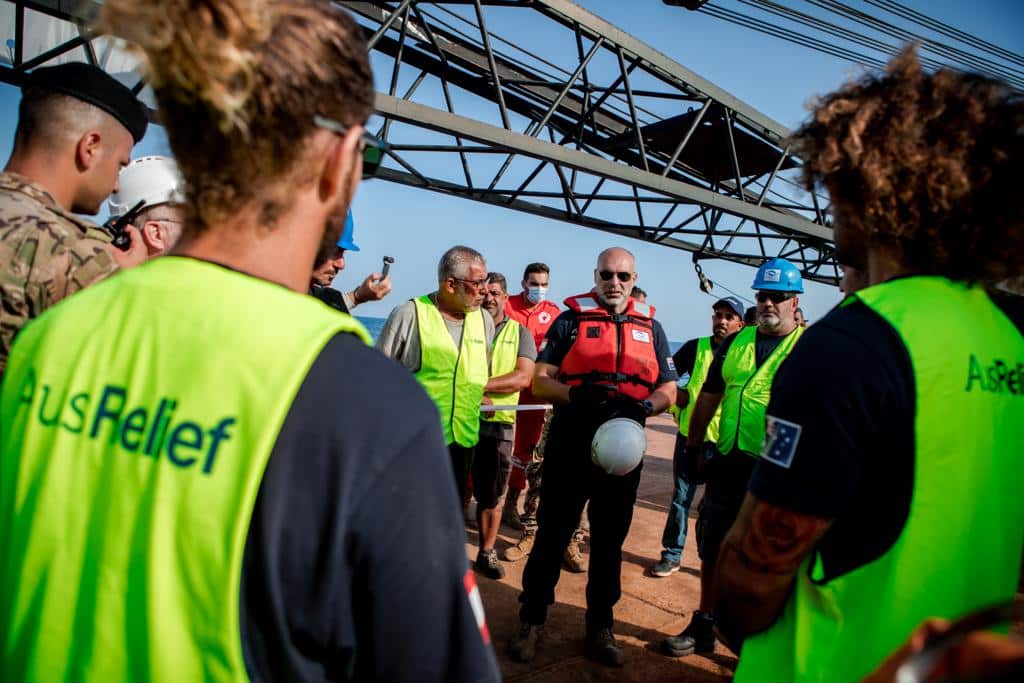 A group of men in hi-vis and hard hats