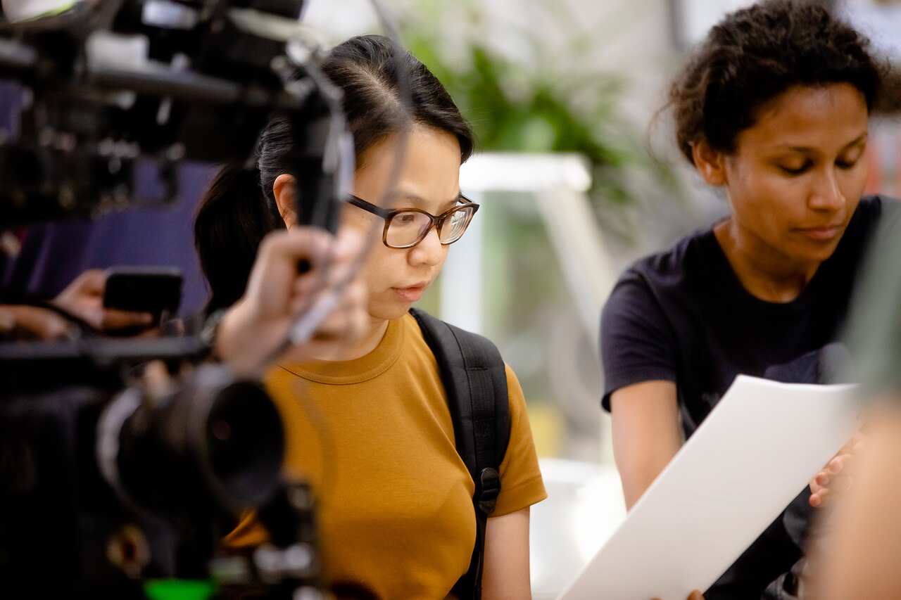 Cassandra Nguyen on set.