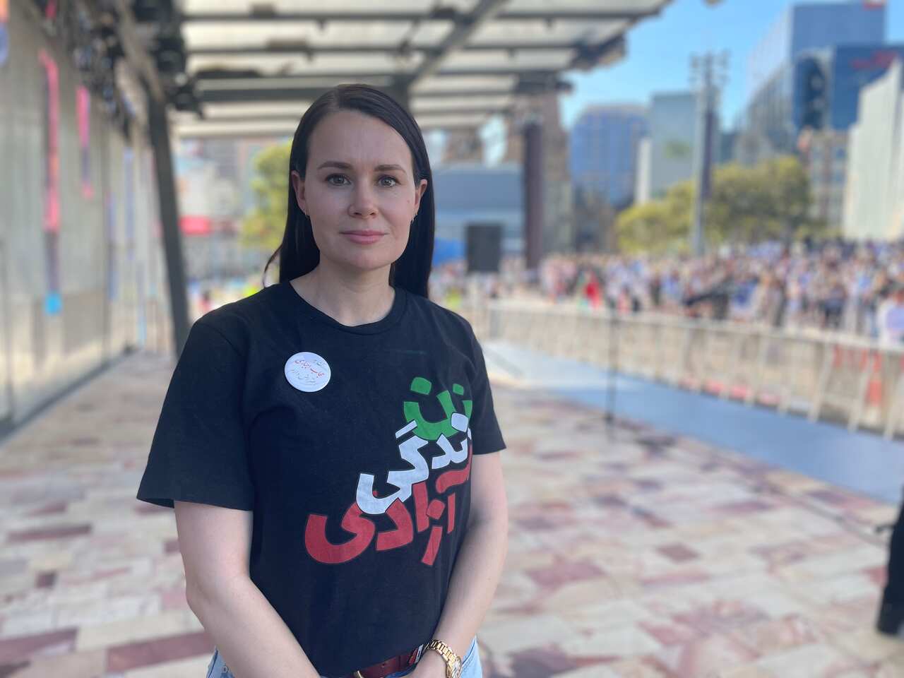 A woman in a black shirt.