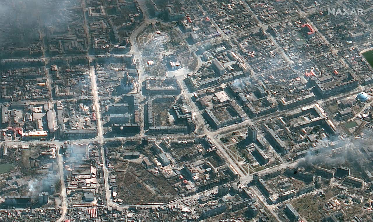Maxar satellite imagery of burning building in Mariupol, Ukraine.  