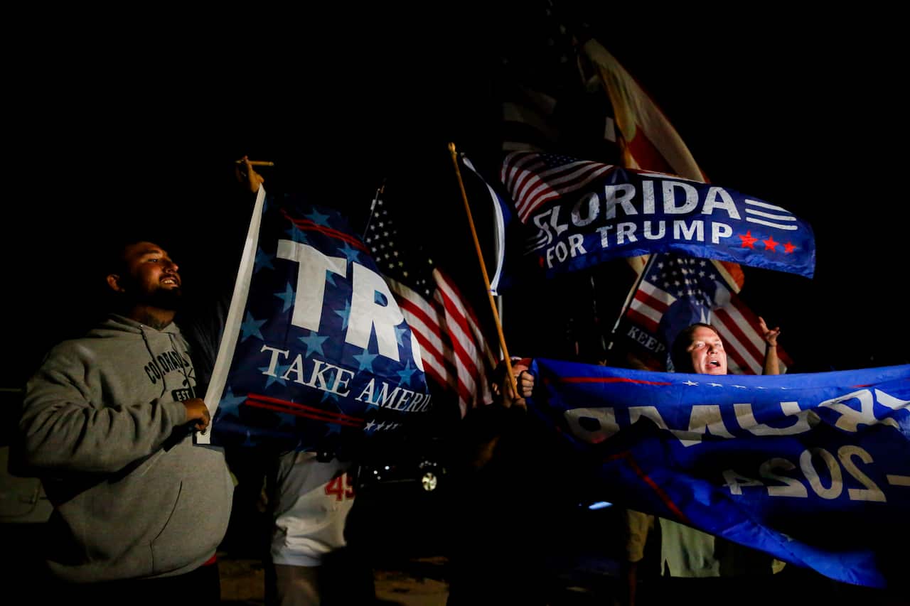 People waving Trump flags. 