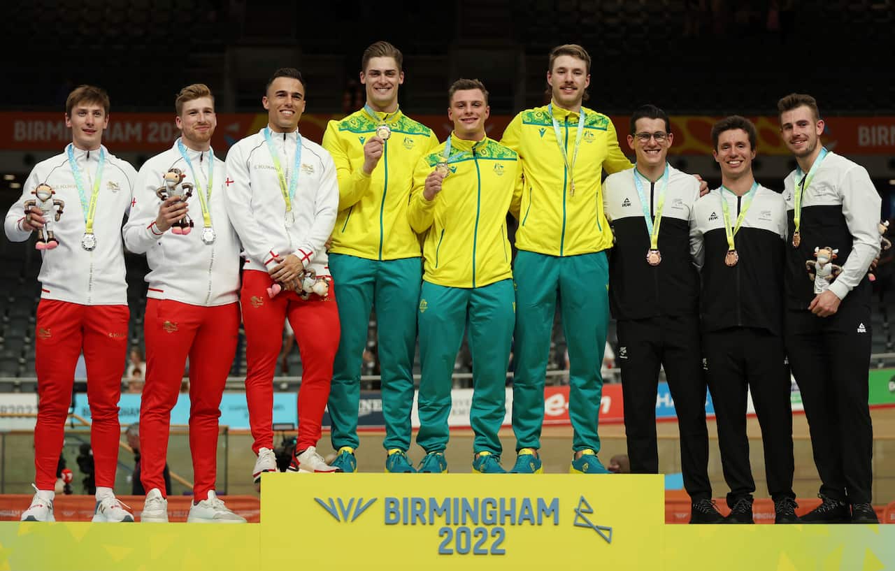Silver medalists from England, gold medalists from Australia and bronze medalists from New Zealand during a medal ceremony for the Men's Team Sprint Gold Final at the Commonwealth Games track cycling.