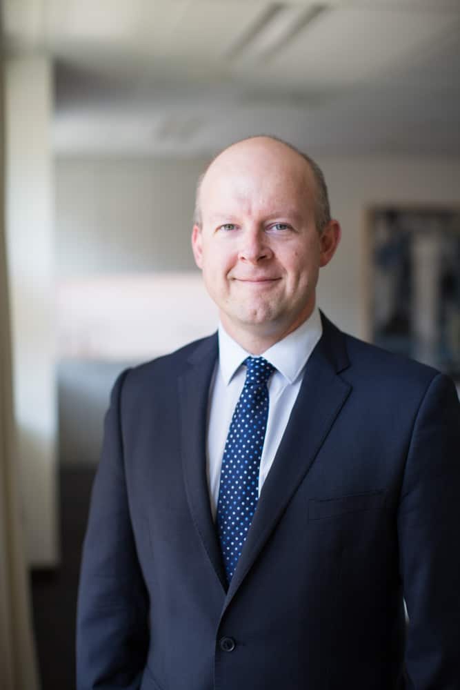 a man wearing a suit and tie 