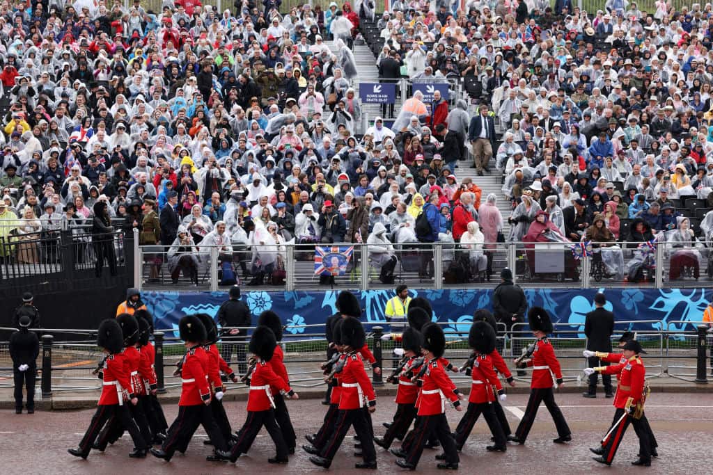 Coldstream Guards marching past the rain soaked crowd ahead of the Coronation of King Charles III and Queen Camilla.
