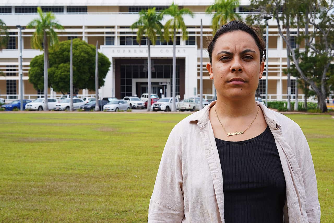 Close up of Mililma May standing outside a building