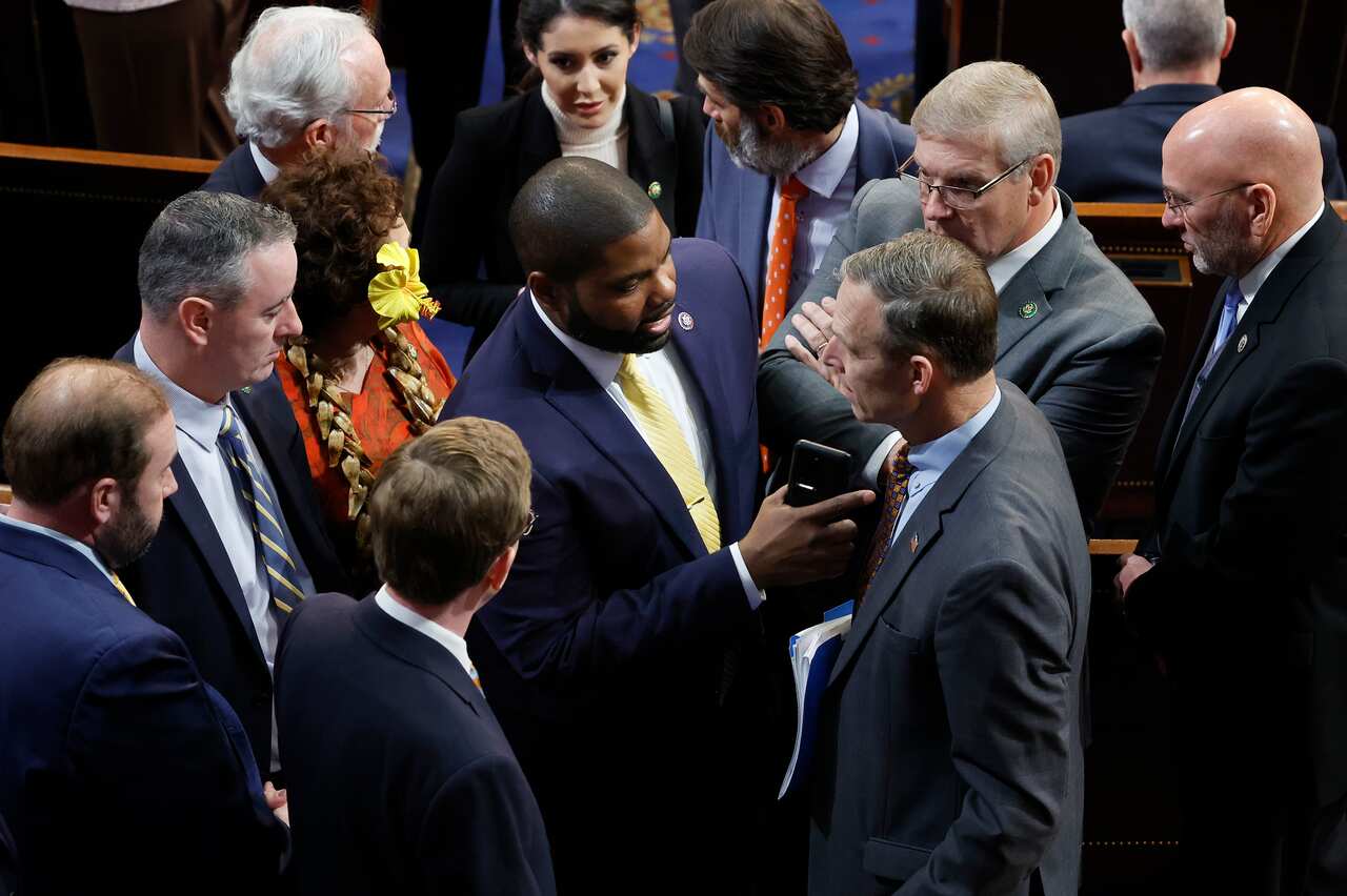 Byron Donalds stands in the middle of a group of Republican members