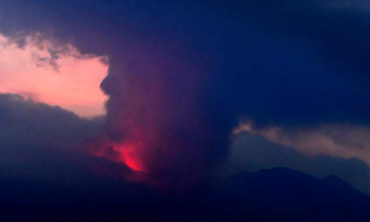 Red haze and a cloud of ash seen above the Sakurajima volcano. 