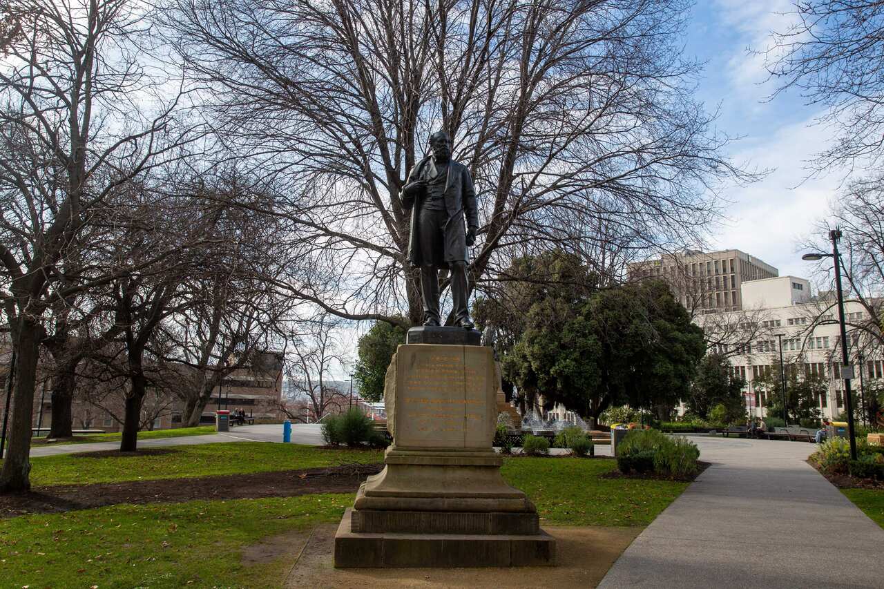 A statue of a man in a park