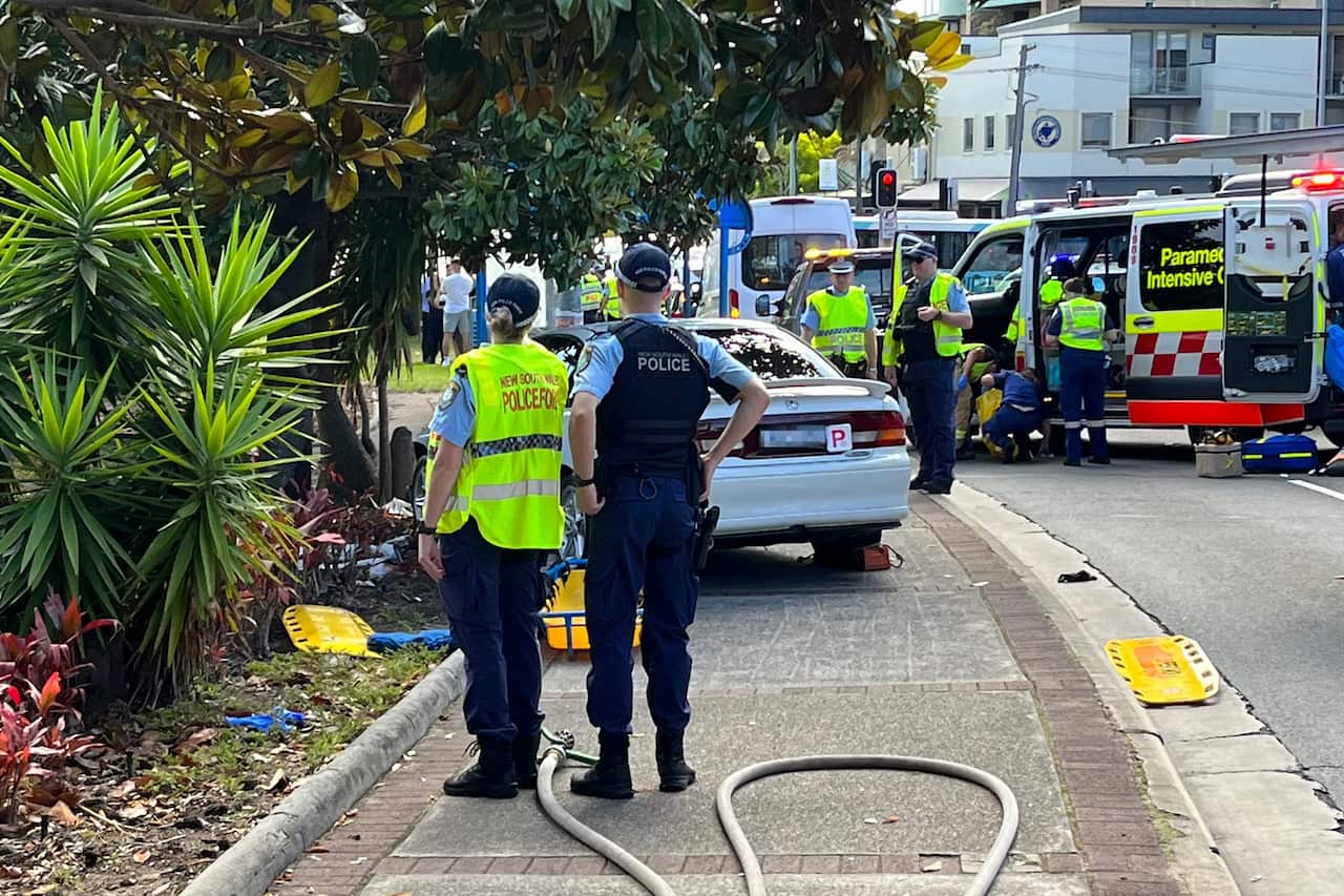 NSW Police officers work at the scene of a crash in Kingsford, Sydney.