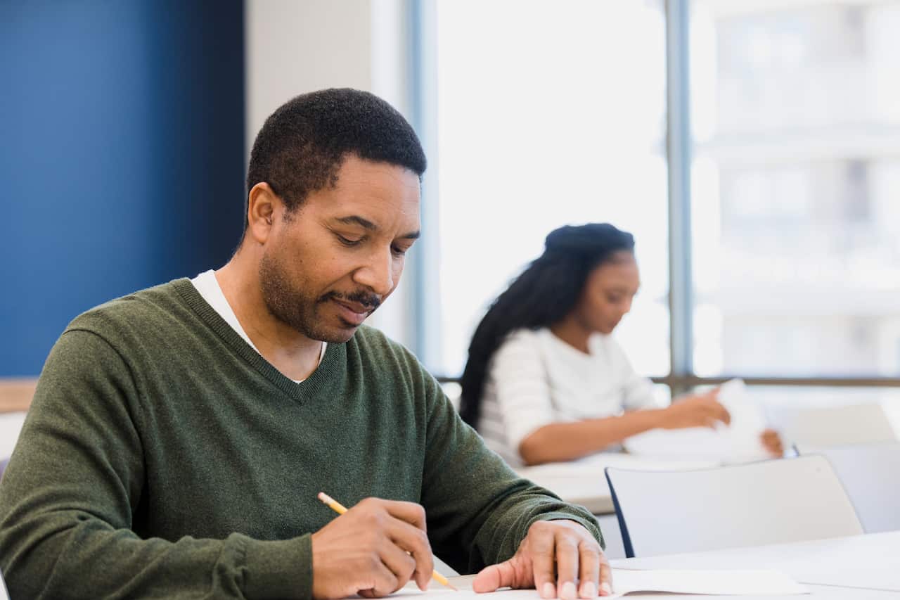Man working on exam