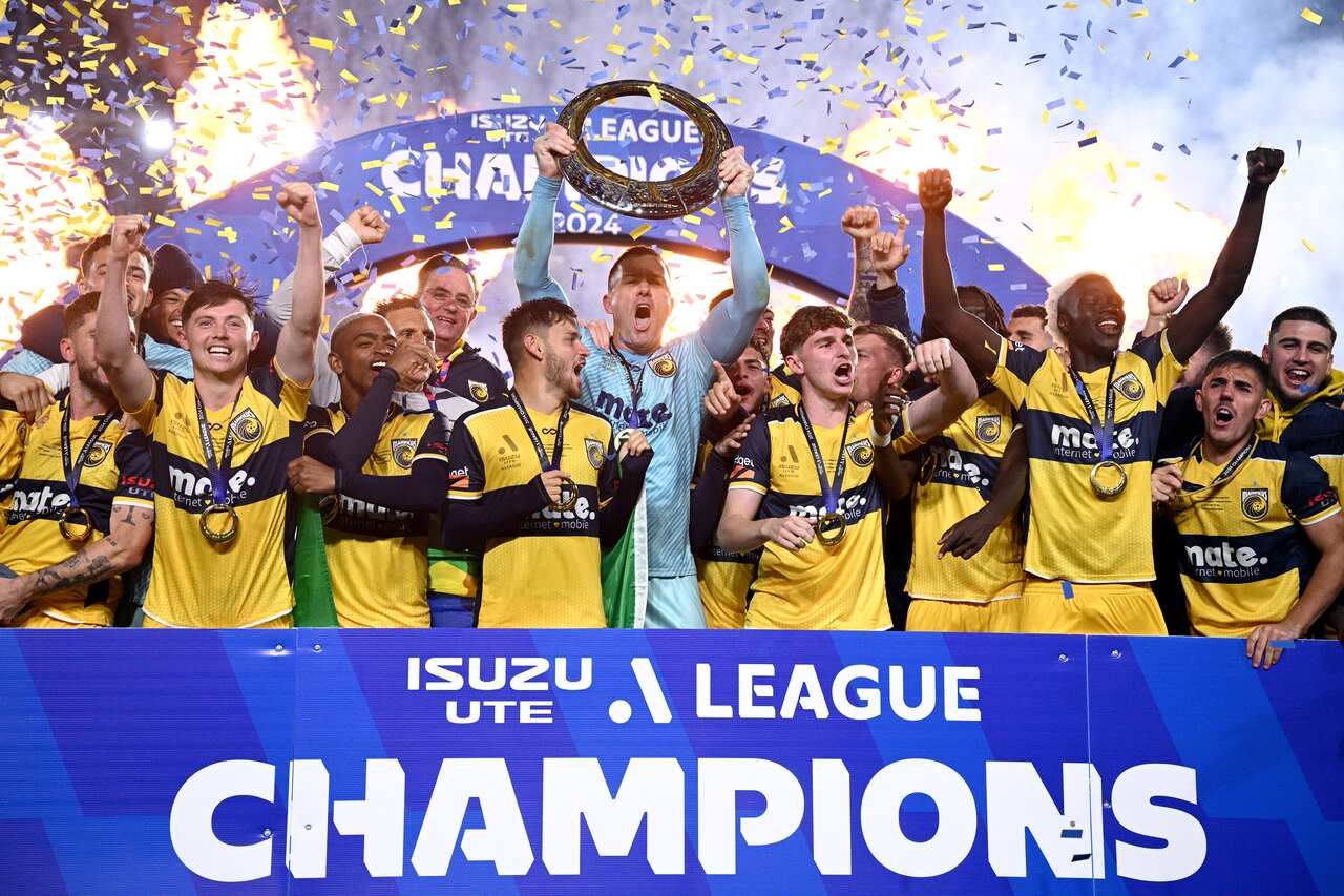 Danny Vukovic (centre) and Mariners teammates celebrate winning the A-League Men Grand Final match against Melbourne Victory at Industree Group Stadium in Gosford, Saturday, May 25, 2024