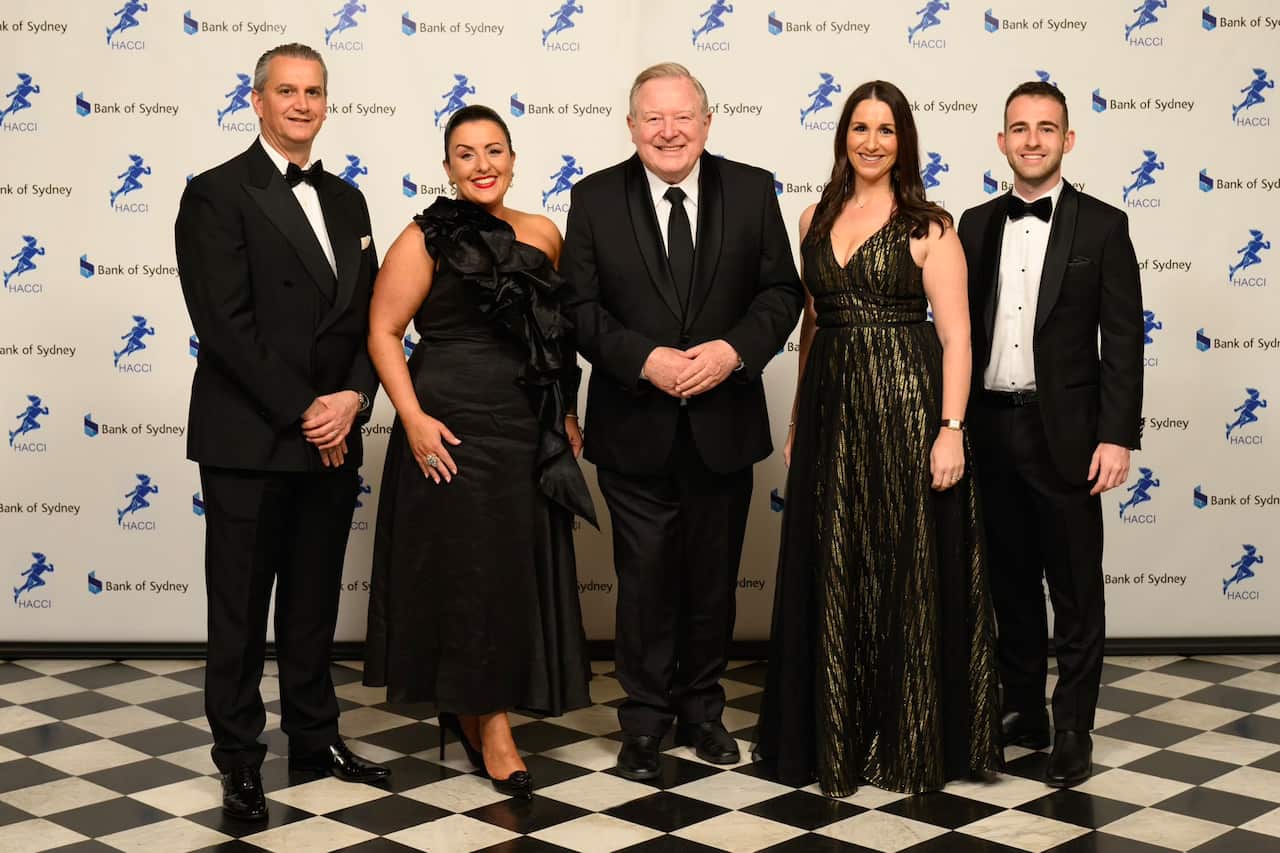 The HACCI Excellence Award Ceremony MC Peter Hitchener, among HACCI Treasurer Peter Zervos, HACCI Chair Fotini Kypraios, and HACCI Board Members Vicky Alexiou and Peter Giasoumi. 